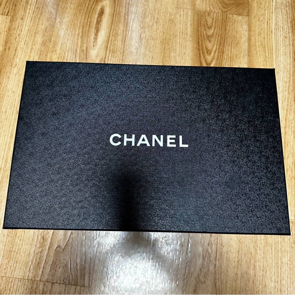 Chanel shoe box with paperwork and 3 new shoe laces